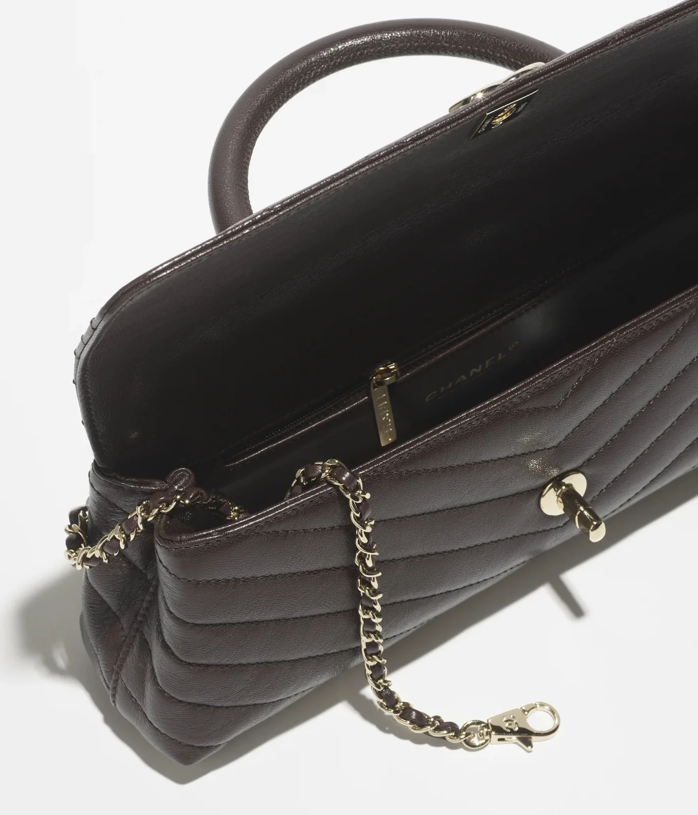 Chanel Maxi flap bag with top handle in black goatskin